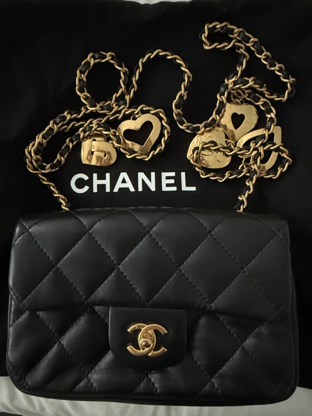 CHANEL Black Quilted Lambskin Shoulder Bag with Gold Chain and Heart Charms